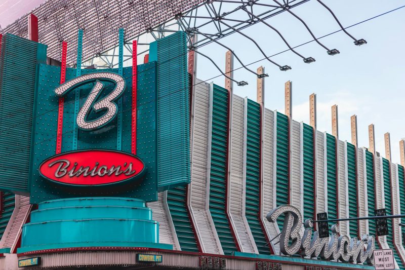 Vibrant facade of Binion's Casino in downtown Las Vegas, featuring classic neon signs and retro architecture.